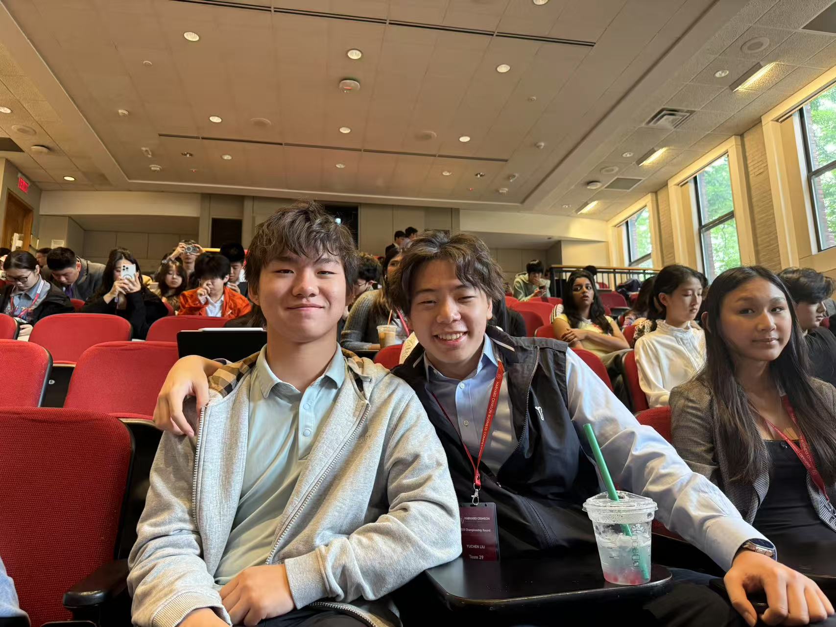 Derek and Teammate in Auditorium